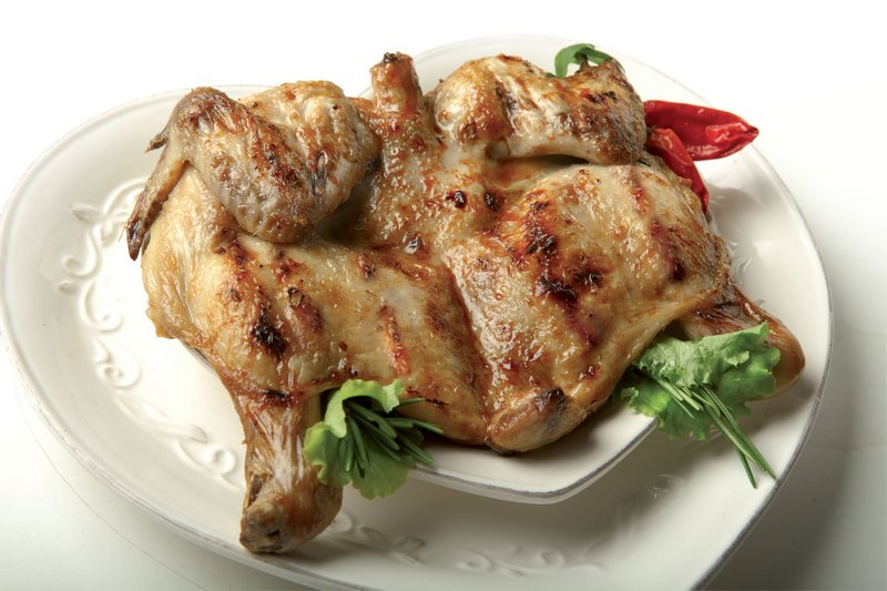 Grilled poussin with peanut sauce